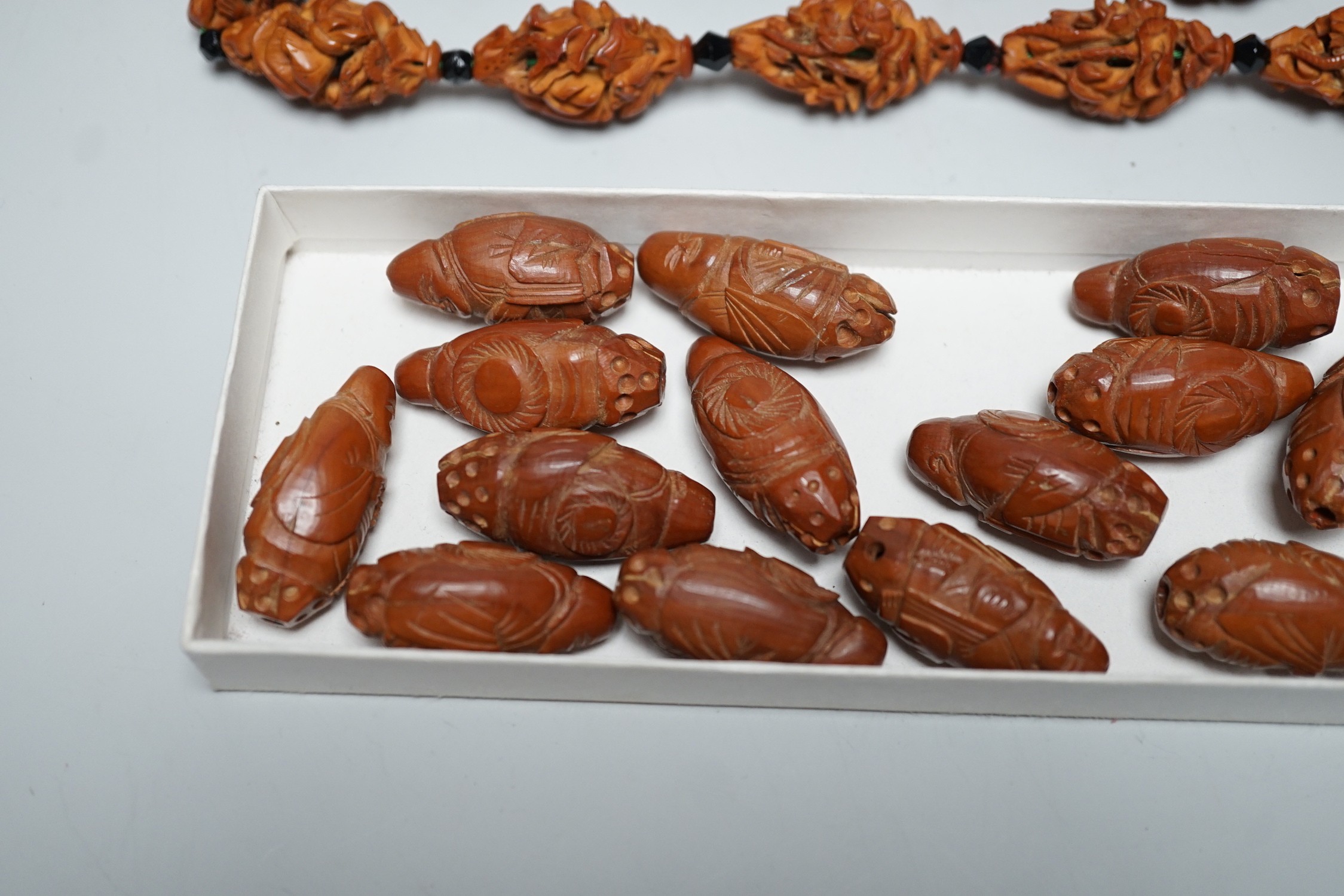 A collection of Chinese carved peach stones, early 20th century
